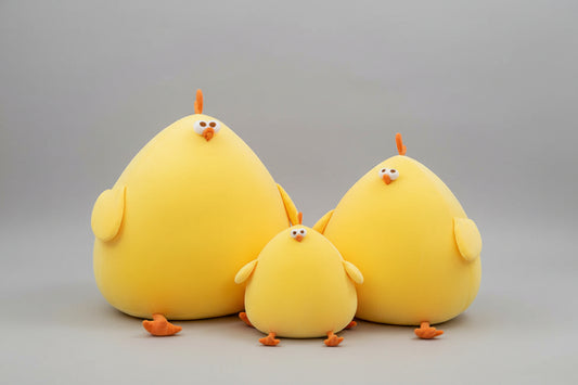Yellow chicken plush toy family with three soft stuffed chicks in different sizes and cute cartoon features.