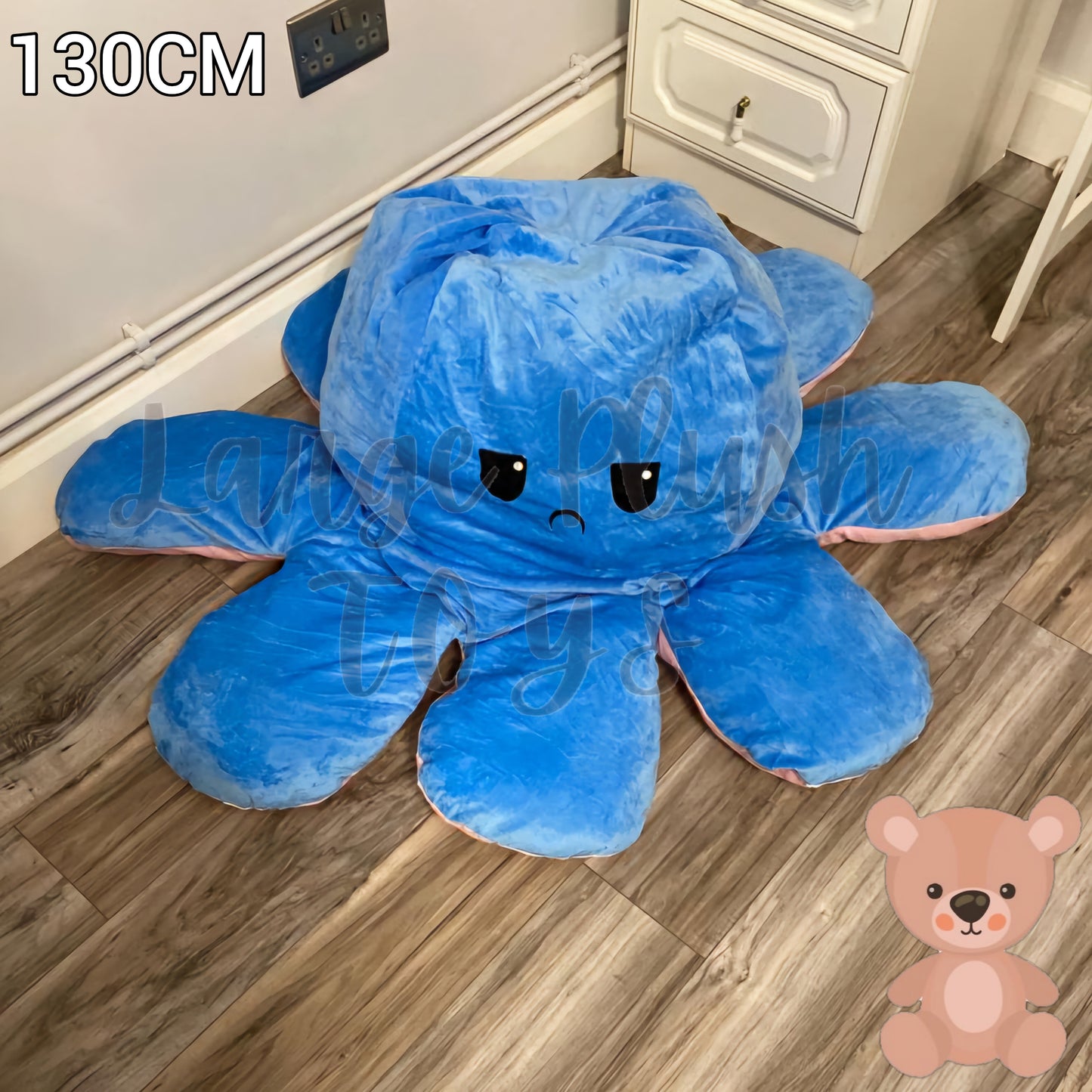 130cm blue and pink reversible octopus plush toy with angry face displayed on a wooden floor.