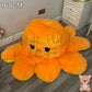 160cm orange and yellow reversible octopus plush toy with sad face displayed on a wooden floor.