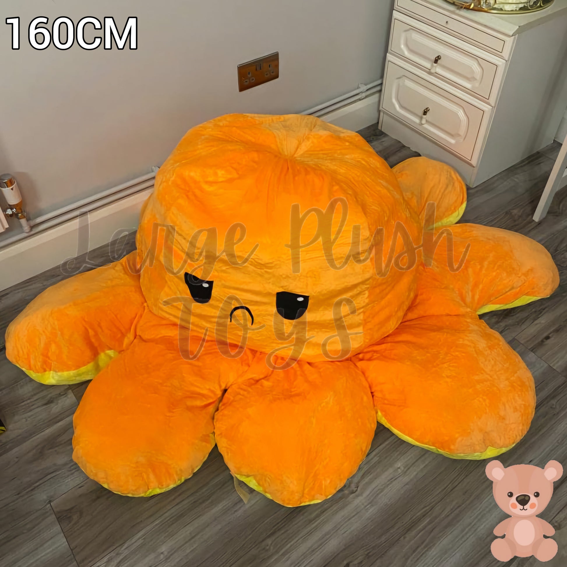 160cm orange and yellow reversible octopus plush toy with sad face displayed on a wooden floor.