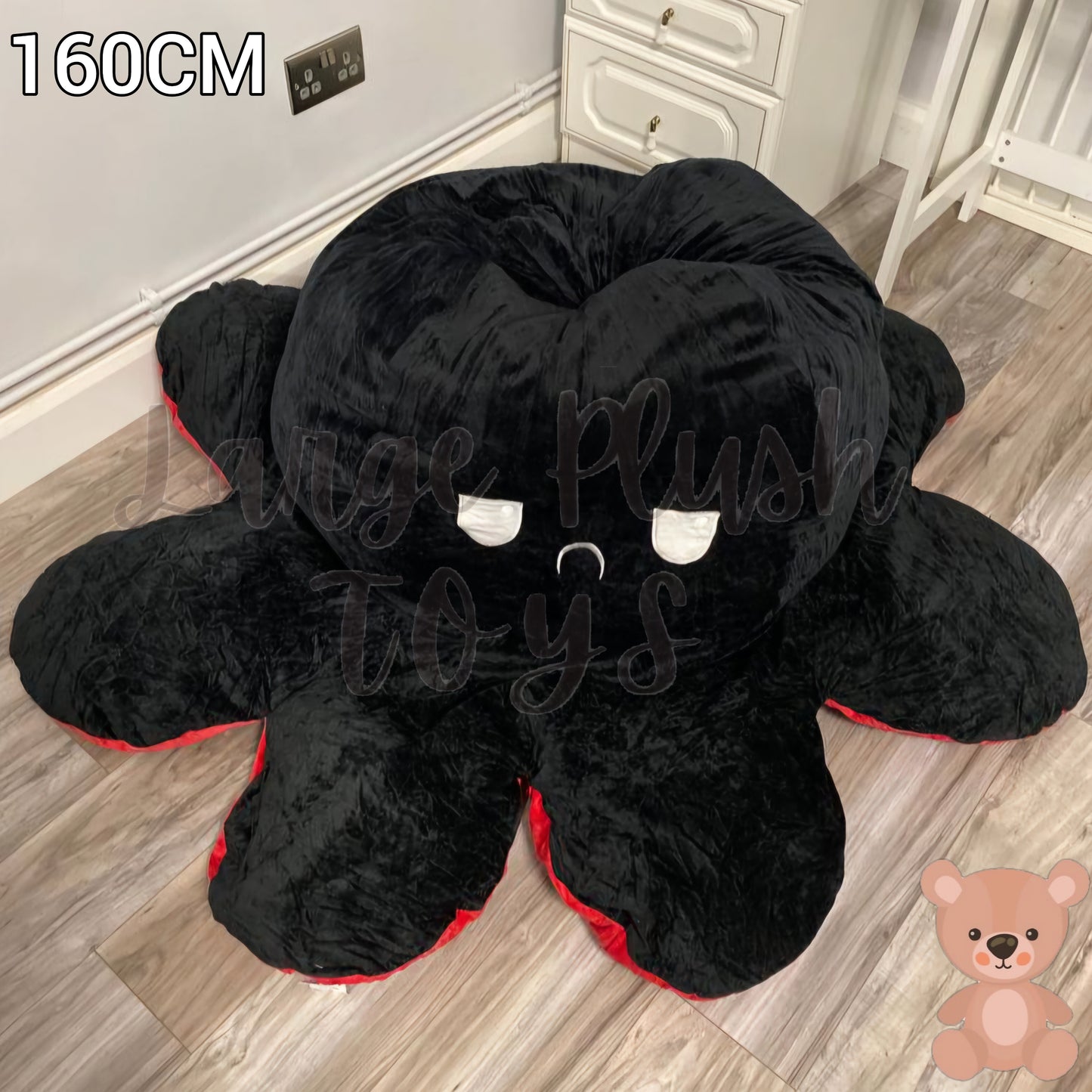160cm reversible octopus plush toy with angry black face displayed on a wooden floor in a home setting.