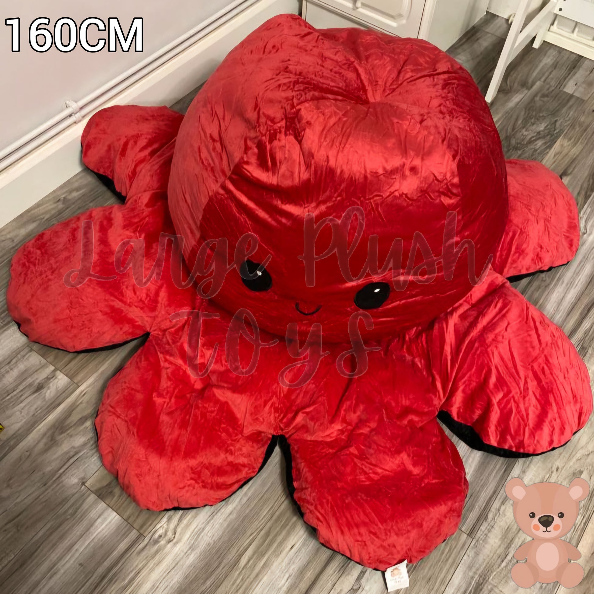 160cm reversible octopus plush toy with happy red face displayed on a wooden floor in a home setting.