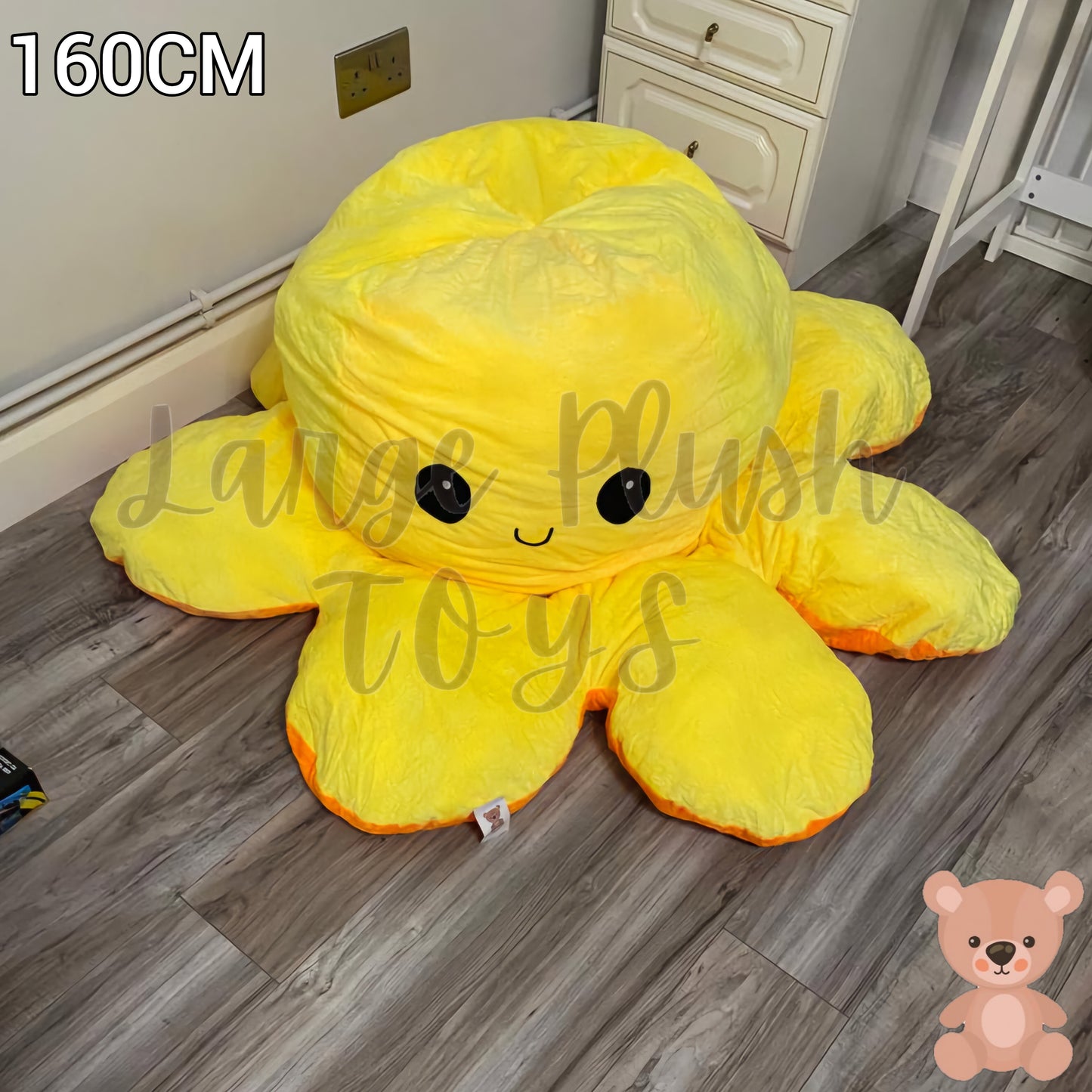 160cm yellow and orange reversible octopus plush toy with happy face displayed on a wooden floor.