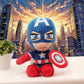 Captain America plush toy holding shield with superhero city skyline background