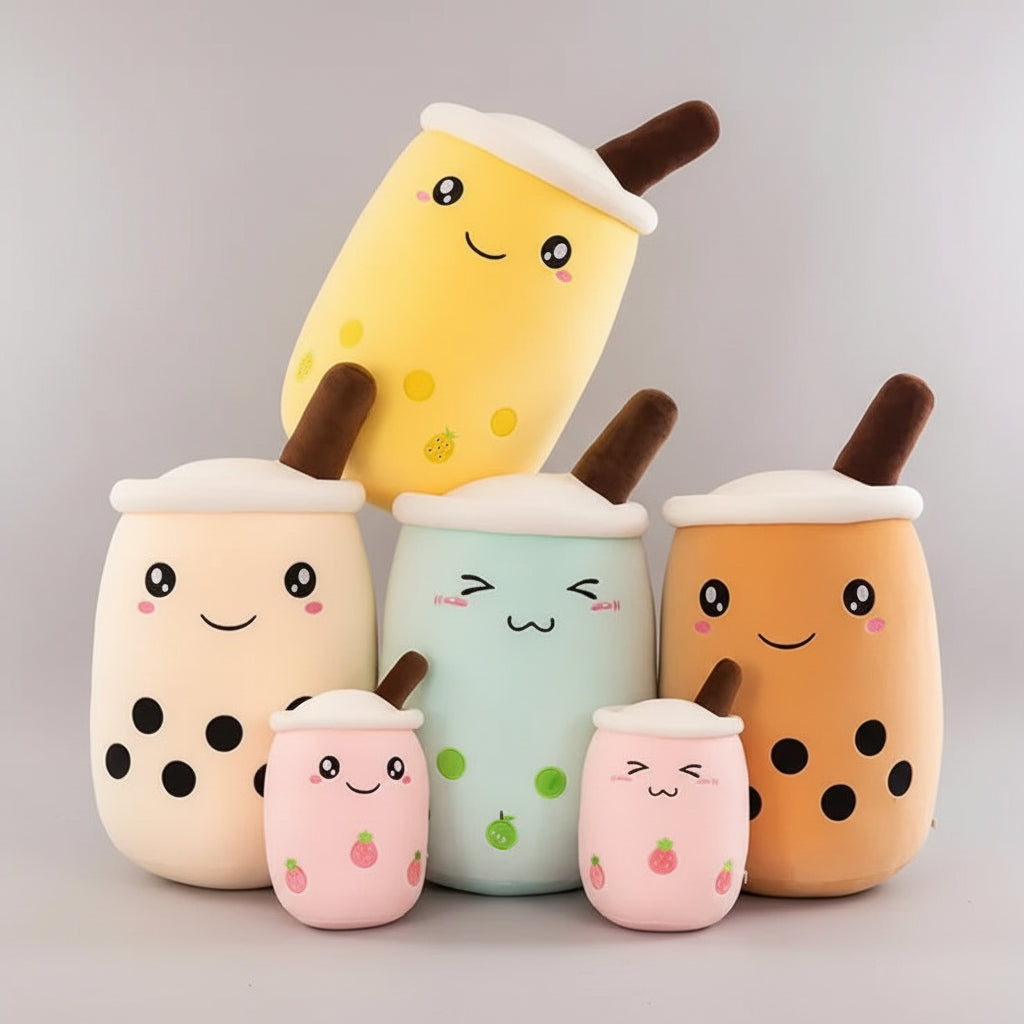 Set of colorful plush toys shaped like bubble tea cups with a person in the background.