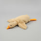 Beige giant goose plush toy pillow with soft stuffing and long body design for cuddling, sleeping and bedroom decor.
