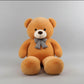 Large beige teddy bear plush toy with decorative bow tie soft stuffed animal gift for children and adults.