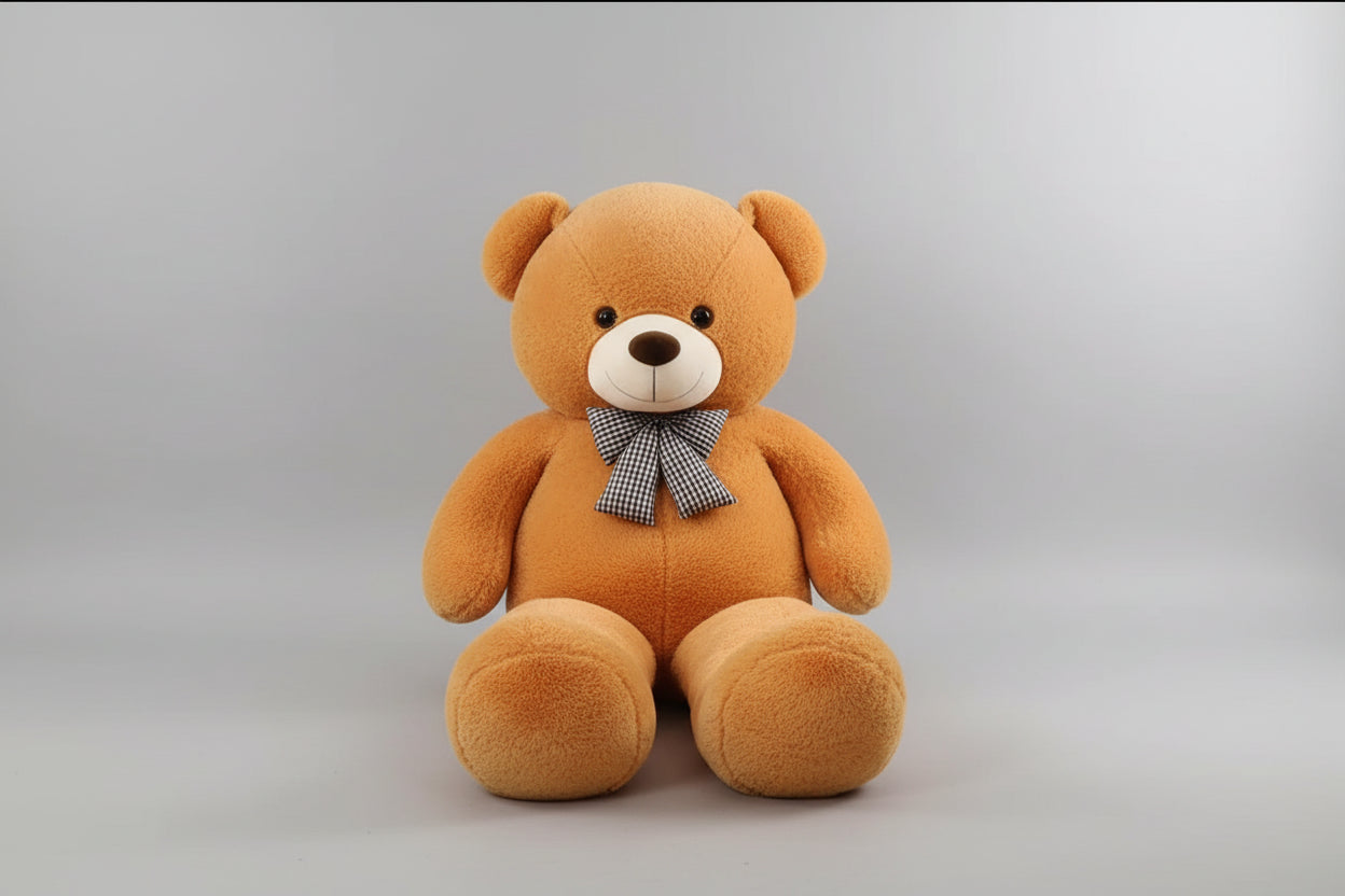 Large beige teddy bear plush toy with decorative bow tie soft stuffed animal gift for children and adults.