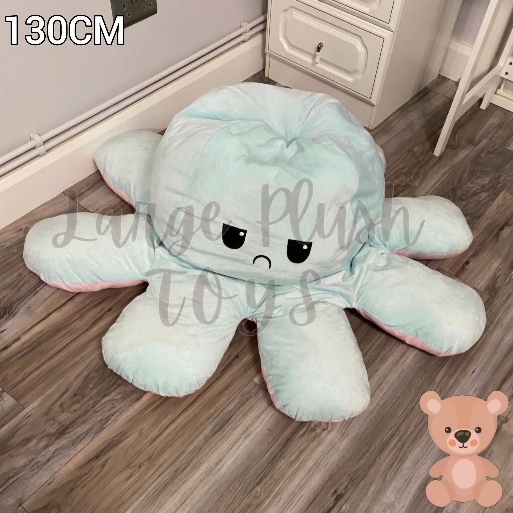 130cm blue and pink reversible octopus plush toy with angry face displayed on a wooden floor.