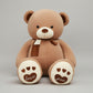 Brown teddy bear plush toy with heart paw details, soft scarf and cuddly stuffed design.
