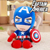 Large Captain America Marvel Avengers plush toy with shield sitting on a sofa in a living room.