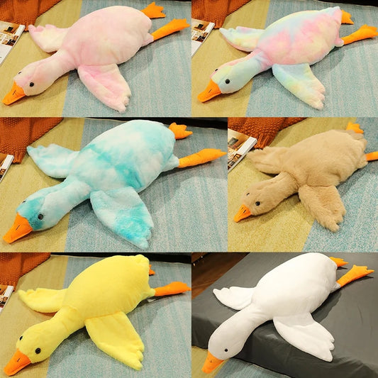 Giant goose plush toy available in white, pink, blue, yellow and pastel tie dye colours for cuddling, sleeping and room decor.
