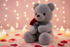 Grey teddy bear plush toy holding a red rose