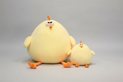 Large and small yellow chicken plush toys sitting together with soft stuffed design and orange feet.