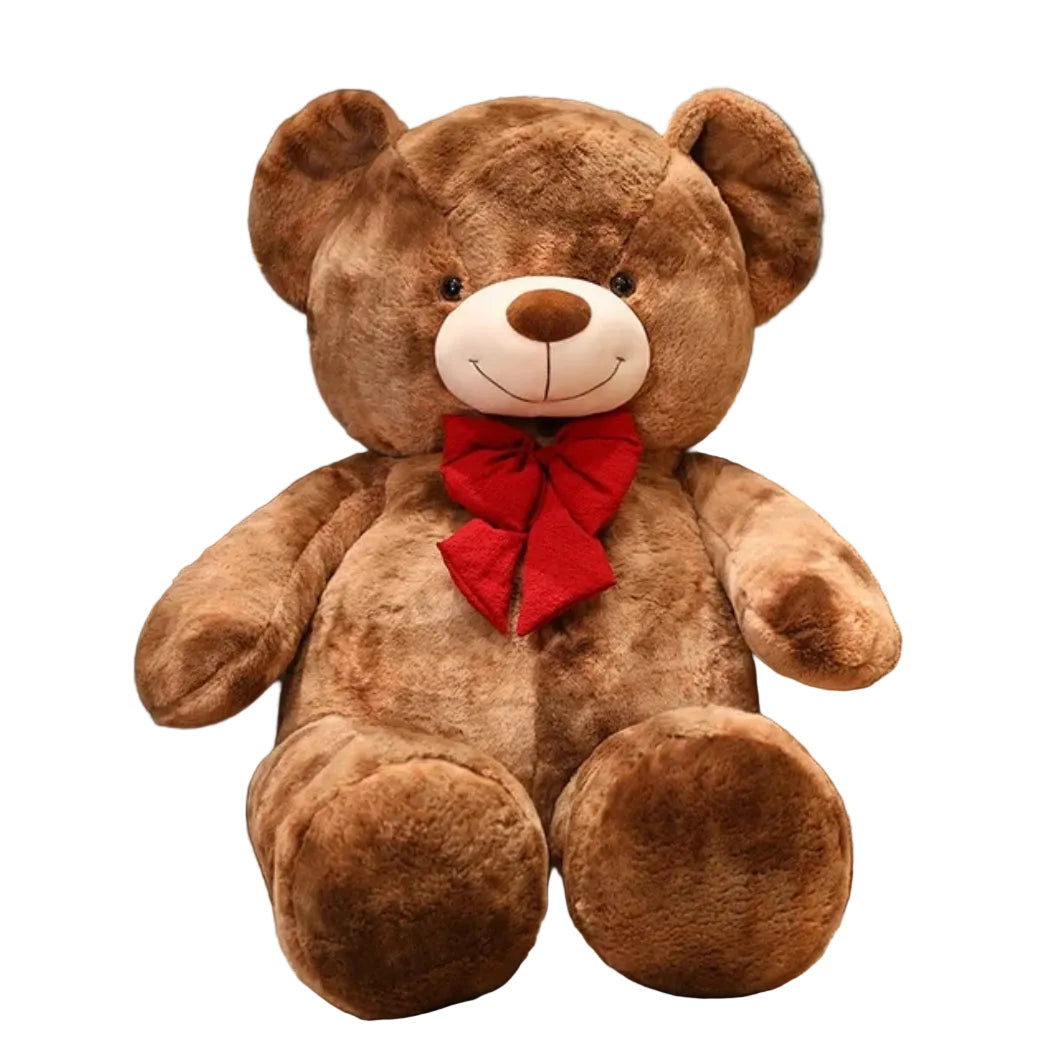 Large brown teddy bear plush toy with a red bow tie sitting on a white background