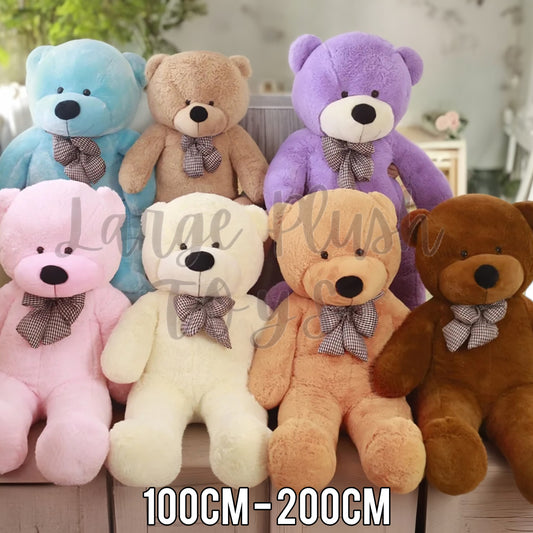 Large teddy bear plush toys available in multiple colours including pink, blue, cream, purple, beige and brown in sizes from 100cm to 200cm.