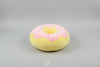 Pink and yellow donut plush pillow with colourful sprinkle details and soft stuffed cushion design.