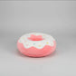 Pink donut plush pillow with white icing, colourful sprinkles and soft stuffed cushion design.