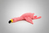 Pink flamingo plush toy lying flat on a white background