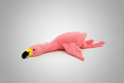 Pink flamingo plush toy lying flat on a white background