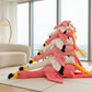 Stack of pink flamingo plush toys displayed in a modern living room setting