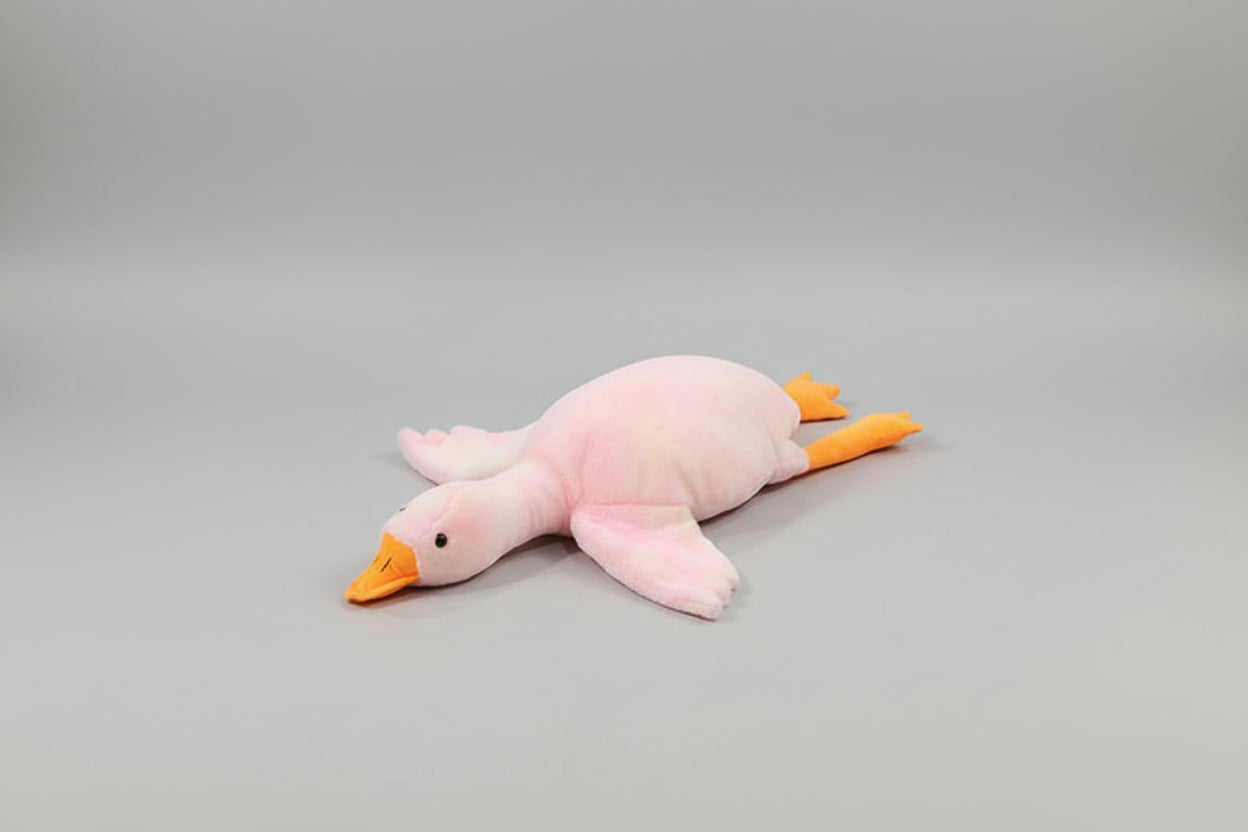 Pink giant goose plush toy pillow with soft stuffing and long body design for cuddling, sleeping and bedroom decor.