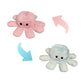 Pink and white reversible octopus plush toy showing happy and angry expressions with colour-changing flip design.