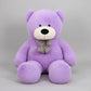 Large purple teddy bear plush toy with decorative bow tie soft stuffed animal gift for children and adults.