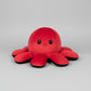 Red and black reversible octopus plush toy with happy expression displayed on a white background.