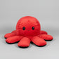 Red and black reversible octopus plush toy with smiling face displayed on a white background.