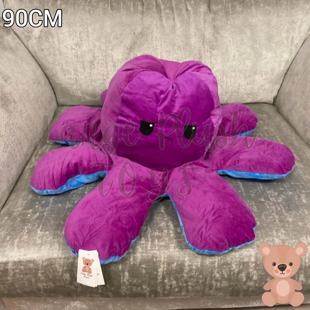 90cm reversible blue and purple octopus plush toy with angry expression, oversized soft stuffed cushion displayed on an armchair.