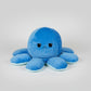 Pastel blue reversible octopus plush toy with a sad expression, soft stuffed cushion for children, sensory play, emotional learning and bedroom decor.