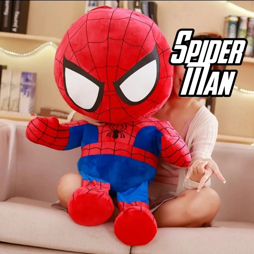 Large Spider-Man Marvel Avengers plush toy sitting on a sofa with a person in the background.