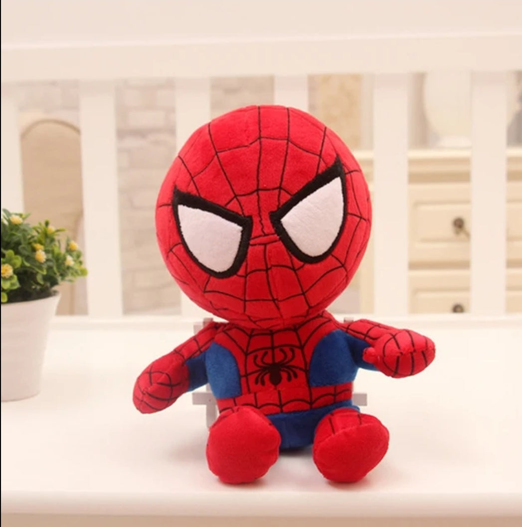 Superman plush toy displayed with superhero city skyline background