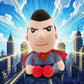 Superman plush toy displayed with superhero city skyline background