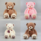 Collection of teddy bear plush toys in pink, cream and brown colours with heart paw details and soft stuffed design.