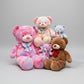 Colourful teddy bear plush toy collection featuring multiple soft stuffed bears in different sizes
