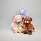 Soft teddy bear plush toy set featuring pastel rainbow bears and a brown teddy bear on a white background