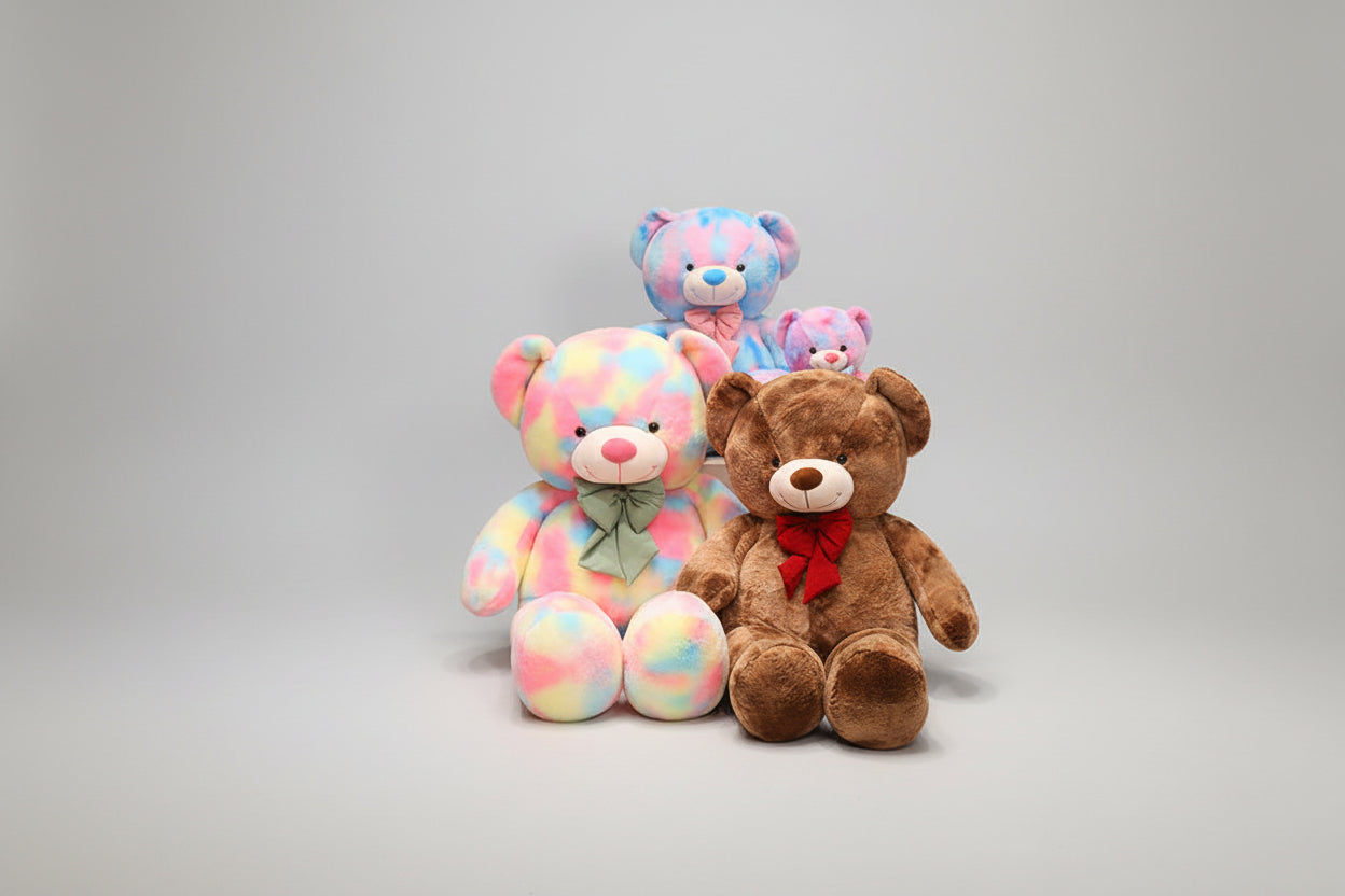 Soft teddy bear plush toy set featuring pastel rainbow bears and a brown teddy bear on a white background