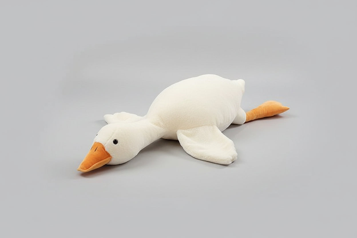 White giant goose plush toy pillow with soft stuffing and long body design for cuddling, sleeping and bedroom decor.