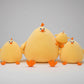 Yellow chicken family plush toy set featuring soft stuffed chicks in multiple sizes with cute cartoon faces.