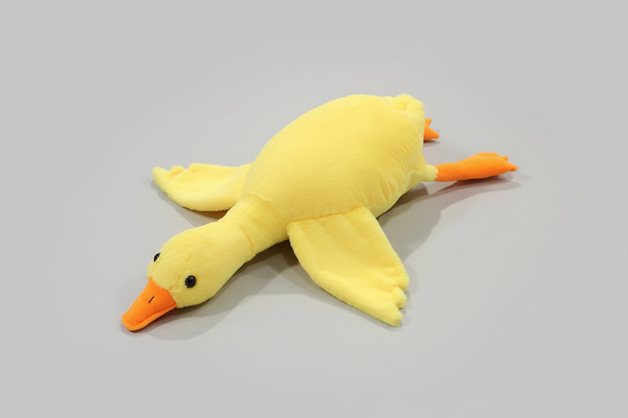 Yellow giant goose plush toy pillow with soft stuffing and long body design for cuddling, sleeping and bedroom decor.